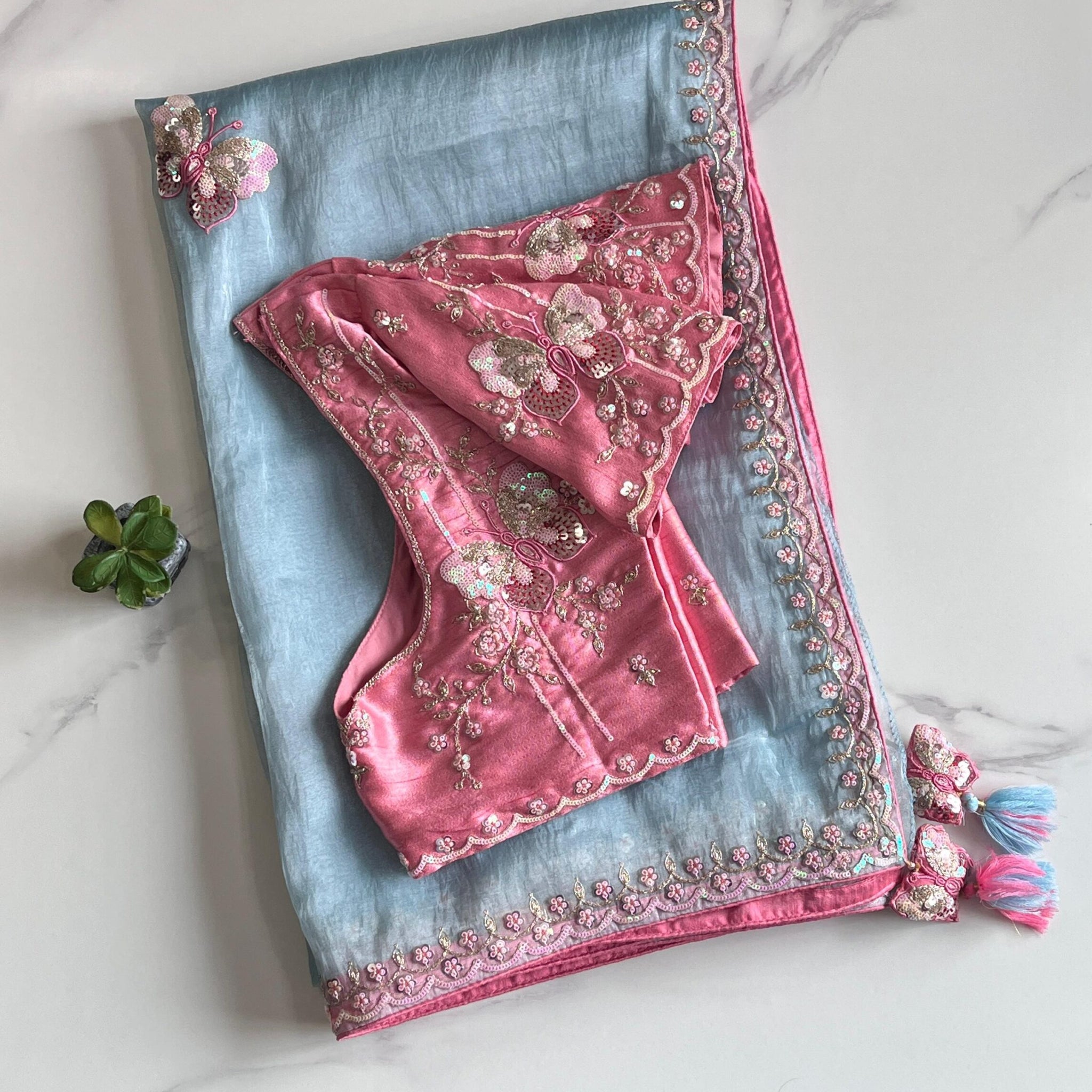 Premium Organza saree with elegant butterflies coding work on all over the sareeScalloped Coding work on either sideContrast piping attached on sareeDesigner Butterfly Tassels as shown Teamed with Designer Stitched blouseFree Size Blouse