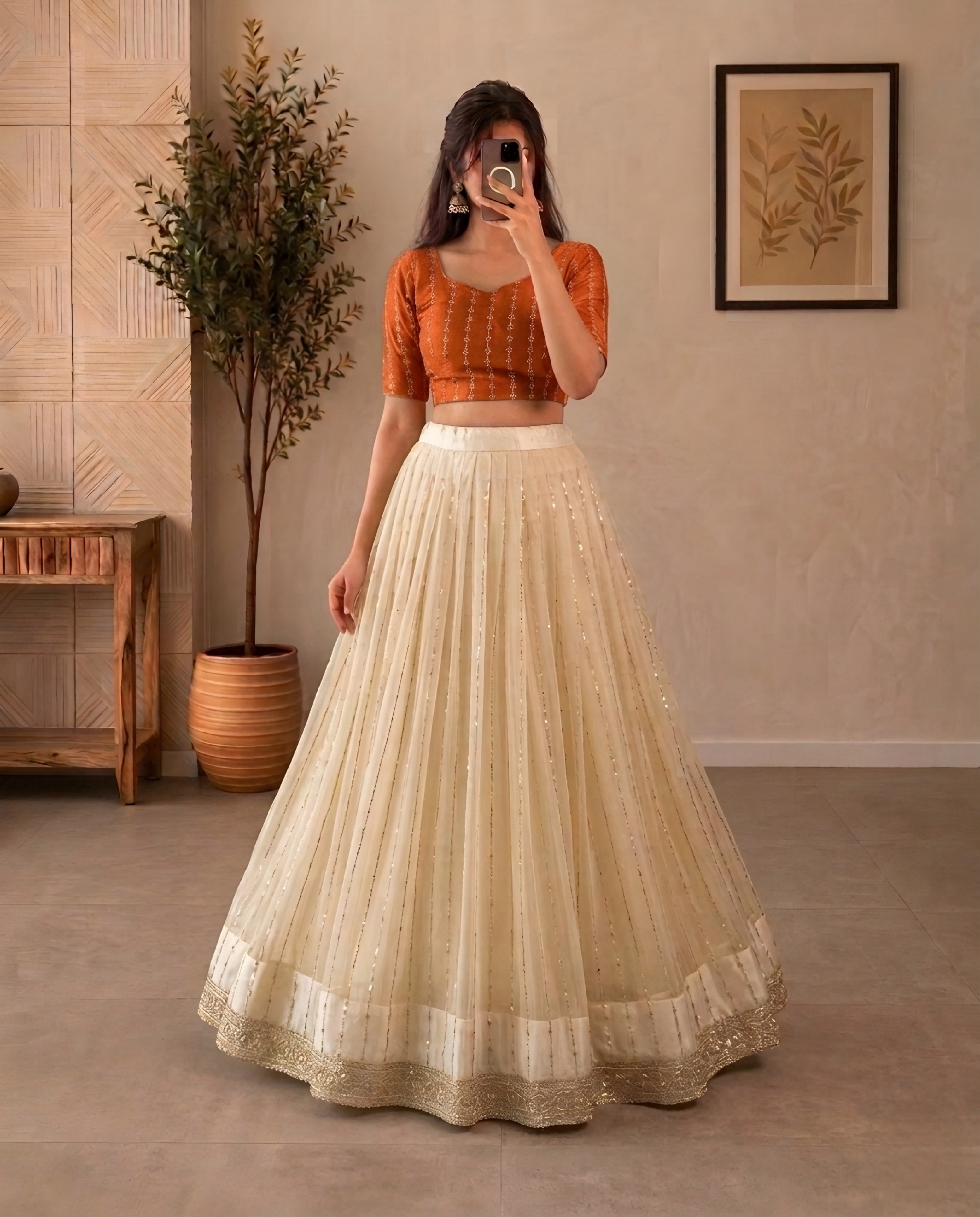 Premium Crop top adorned with intricate bead work with Fully flared premium shining net skirt embellished with all-over sequins work