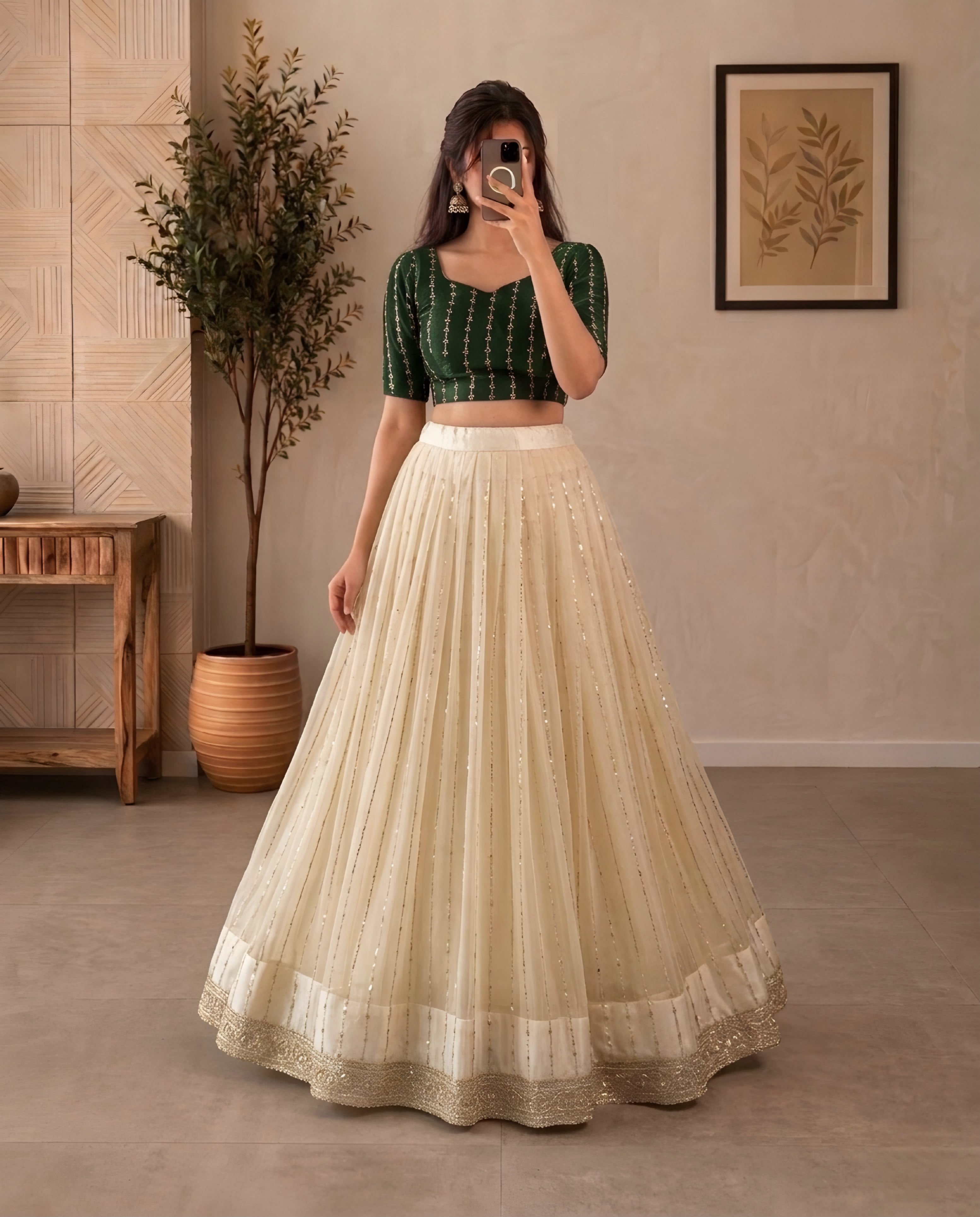 Premium Crop top adorned with intricate bead work with Fully flared premium shining net skirt embellished with all-over sequins work