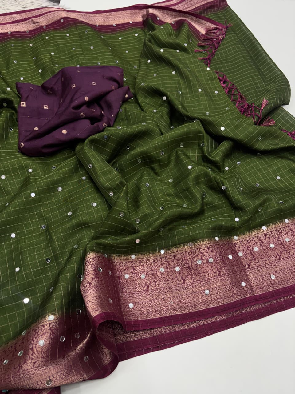 Soft Dola Checks Saree with Mirror Work & Tassels
Dyeble Blouse