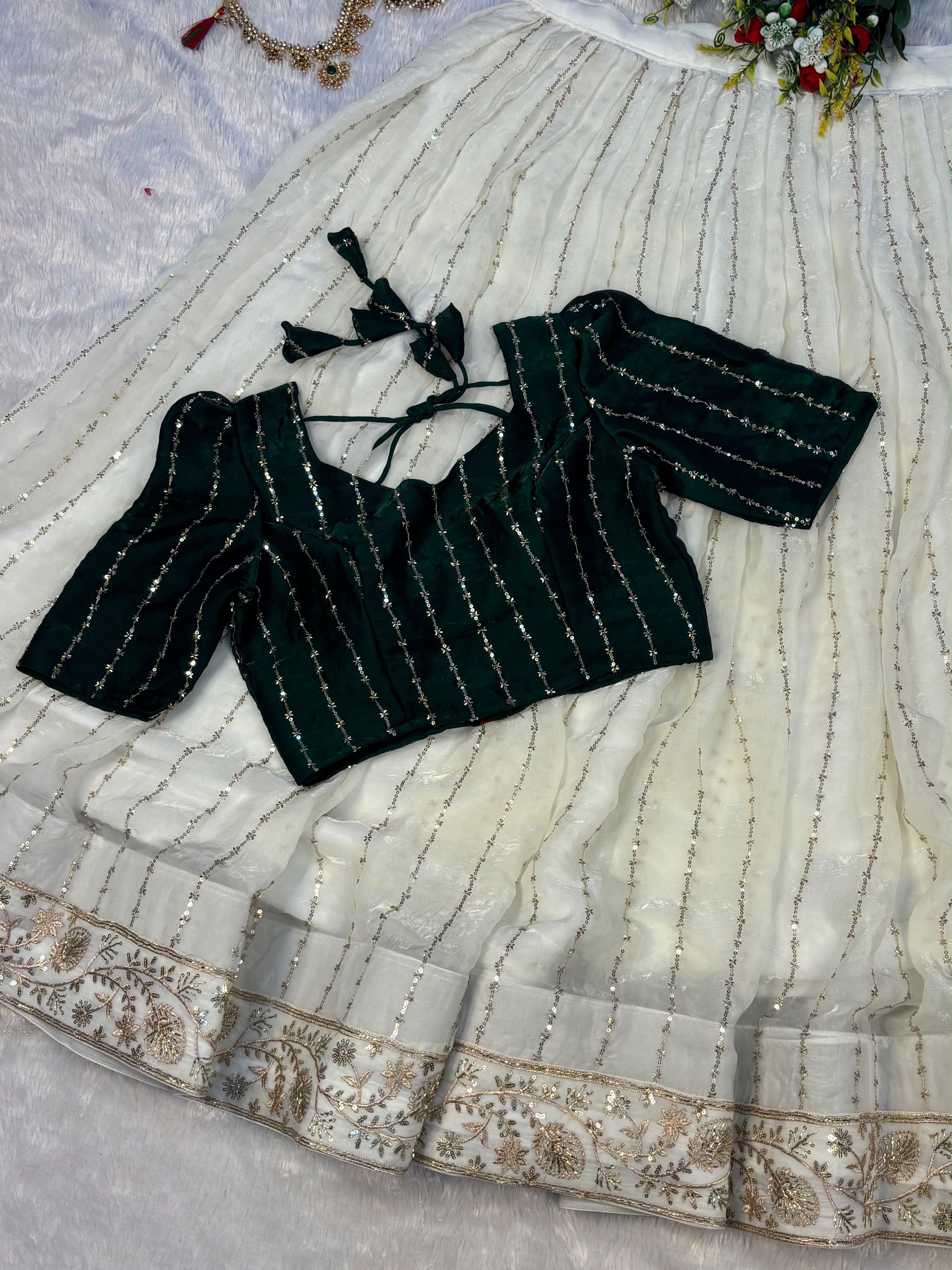 Premium Crop top adorned with intricate bead work with Fully flared premium shining net skirt embellished with all-over sequins work